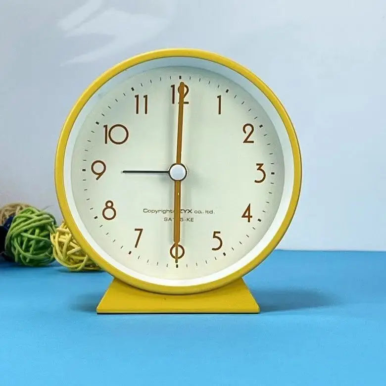 A Cute and Simple Round Bedside Table with A Clock Timer and A Small Student Alarm Clock Oasis Select Yellow