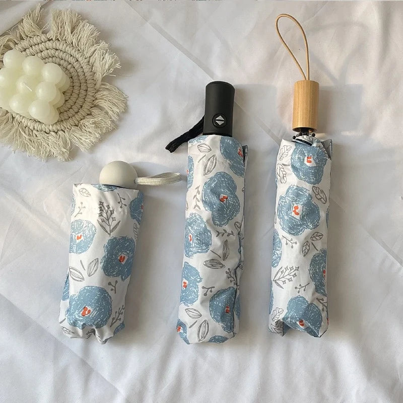 Blue floral automatic umbrella black vinyl dual-use for sunny and rainy sun protection UV protection folding portable umbrella. Oasis Select