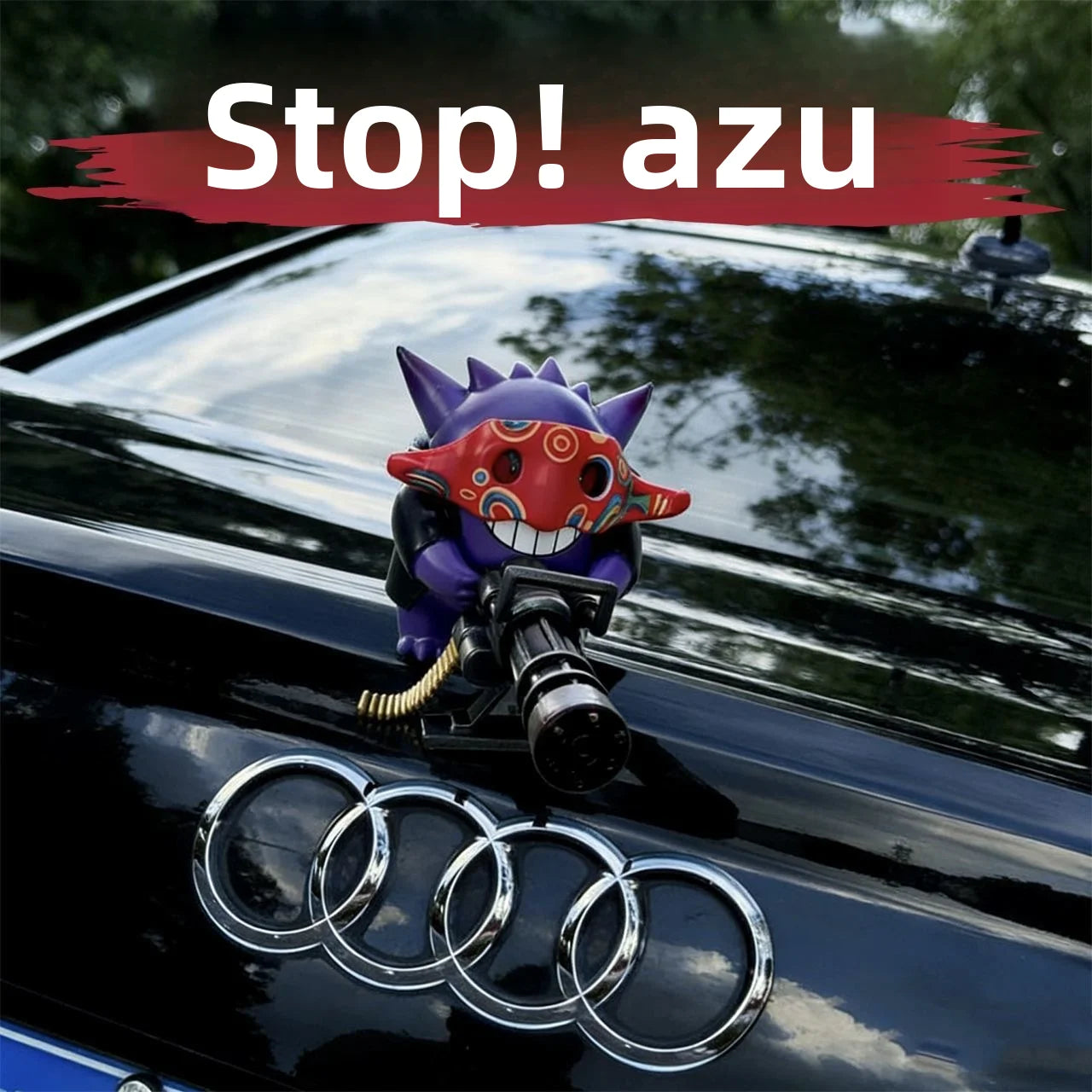 Azu holding a Gatling gun, a creative car decoration for the center console, a figurine on the roof and rear of the car. Oasis Select