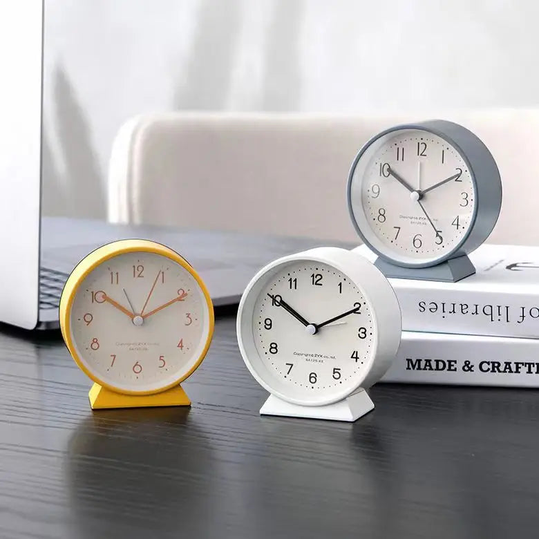 A Cute and Simple Round Bedside Table with A Clock Timer and A Small Student Alarm Clock Oasis Select